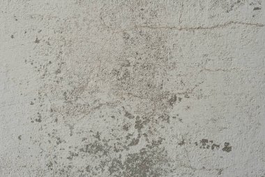 Çizikler ve çatlaklar ile duvar parçası. Arka plan olarak kullanılabilir