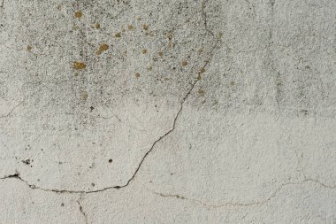 Çizikler ve çatlaklar ile duvar parçası. Arka plan olarak kullanılabilir