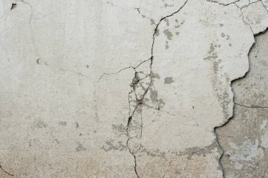 Çizikler ve çatlaklar ile duvar parçası. Arka plan olarak kullanılabilir