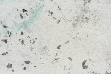 Çizikler ve çatlaklar ile duvar parçası. Arka plan olarak kullanılabilir
