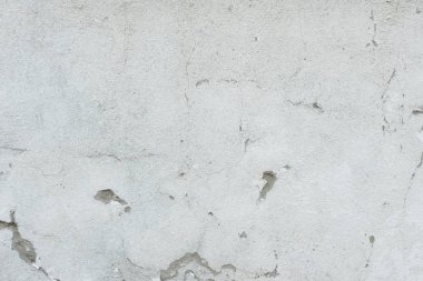 Çizikler ve çatlaklar ile duvar parçası. Arka plan olarak kullanılabilir