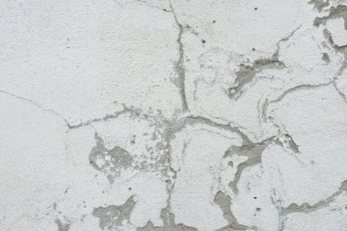 Çizikler ve çatlaklar ile duvar parçası. Arka plan olarak kullanılabilir