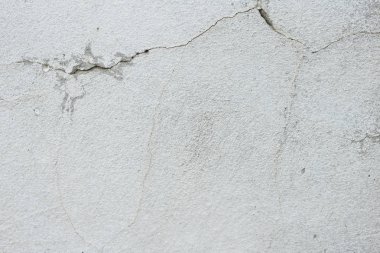 Çizikler ve çatlaklar ile duvar parçası. Arka plan olarak kullanılabilir