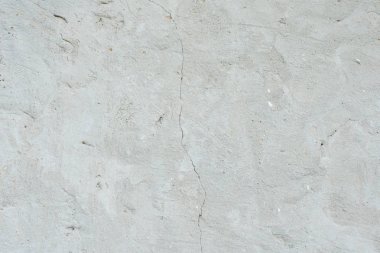 Çizikler ve çatlaklar ile duvar parçası. Arka plan olarak kullanılabilir