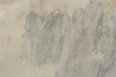 Çizikler ve çatlaklar ile duvar parçası. Arka plan olarak kullanılabilir