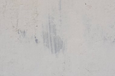 Çizikler ve çatlaklar ile duvar parçası. Arka plan olarak kullanılabilir