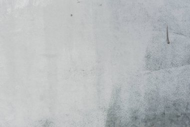 Çizikler ve çatlaklar ile duvar parçası. Arka plan olarak kullanılabilir