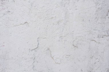 Çizikler ve çatlaklar ile duvar parçası. Arka plan olarak kullanılabilir