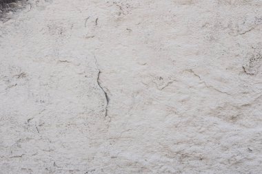 Çizikler ve çatlaklar ile duvar parçası. Arka plan olarak kullanılabilir