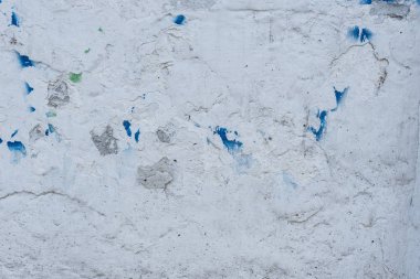 Çizikler ve çatlaklar ile duvar parçası. Arka plan olarak kullanılabilir