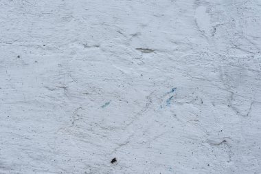 Çizikler ve çatlaklar ile duvar parçası. Arka plan olarak kullanılabilir