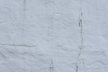 Çizikler ve çatlaklar ile duvar parçası. Arka plan olarak kullanılabilir