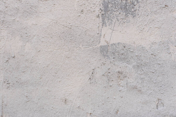 Фрагмент стены с царапинами и трещинами. Его можно использовать в качестве фона
