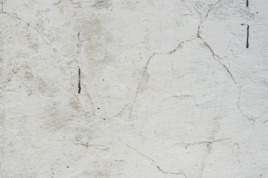 Çizikler ve çatlaklar ile duvar parçası. Arka plan olarak kullanılabilir