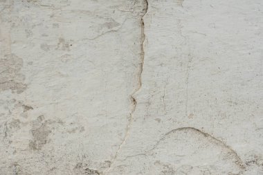 Çizikler ve çatlaklar ile duvar parçası. Arka plan olarak kullanılabilir