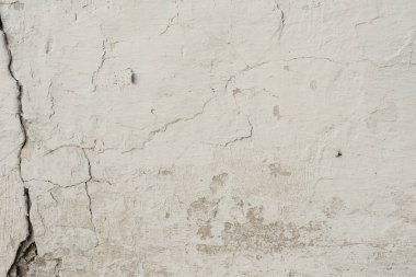 Çizikler ve çatlaklar ile duvar parçası. Arka plan olarak kullanılabilir