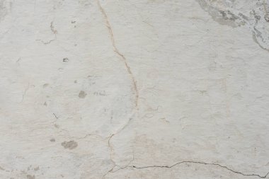 Çizikler ve çatlaklar ile duvar parçası. Arka plan olarak kullanılabilir