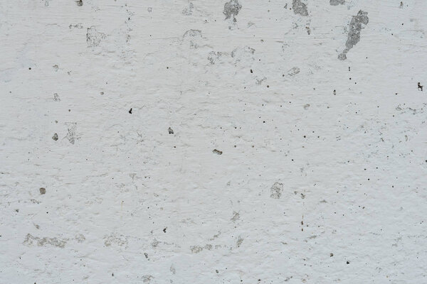 Фрагмент стены с царапинами и трещинами. Его можно использовать в качестве фона
