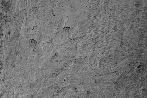 Фрагмент стены с царапинами и трещинами. Его можно использовать в качестве фона
