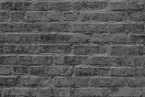 Кирпичная текстура с царапинами и трещинами. Его можно использовать в качестве фона
