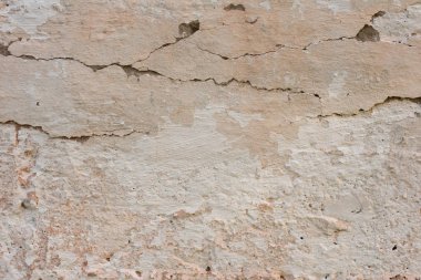 Çizikler ve çatlaklar ile duvar parçası. Arka plan olarak kullanılabilir