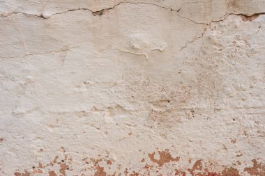 Çizikler ve çatlaklar ile duvar parçası. Arka plan olarak kullanılabilir