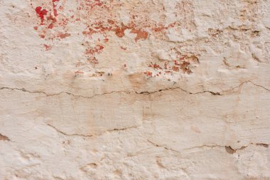 Çizikler ve çatlaklar ile duvar parçası. Arka plan olarak kullanılabilir