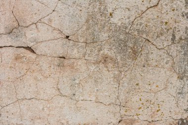 Çizikler ve çatlaklar ile duvar parçası. Arka plan olarak kullanılabilir