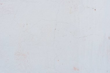 Çizikler ve çatlaklar ile duvar parçası. Arka plan olarak kullanılabilir