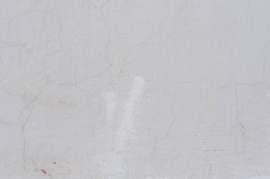 Çizikler ve çatlaklar ile duvar parçası. Arka plan olarak kullanılabilir