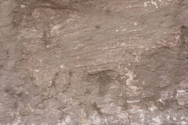 Çizikler ve çatlaklar ile duvar parçası. Arka plan olarak kullanılabilir