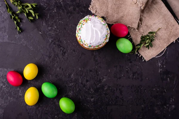 Easter, cake, eggs, holiday. Easter cake and colorful eggs on a dark background. It can be used as a background