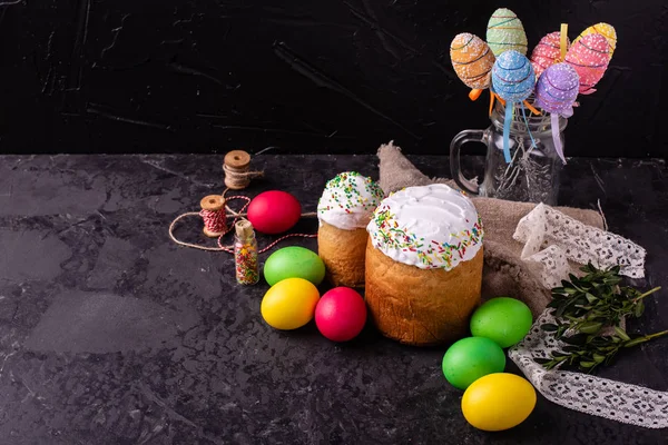 Easter, cake, eggs, holiday. Easter cake and colorful eggs on a dark background. It can be used as a background