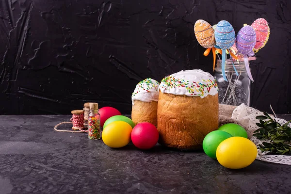 Easter, cake, eggs, holiday. Easter cake and colorful eggs on a dark background. It can be used as a background