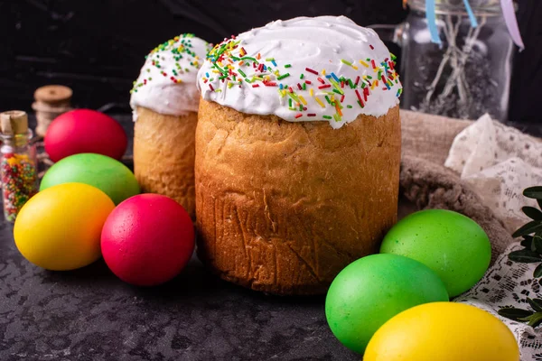 Easter, cake, eggs, holiday. Easter cake and colorful eggs on a dark background. It can be used as a background