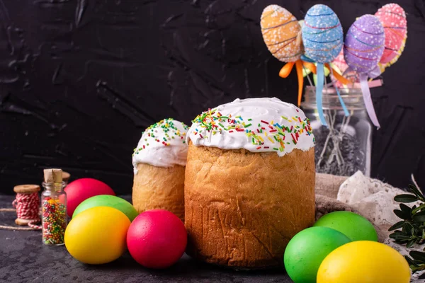 Easter, cake, eggs, holiday. Easter cake and colorful eggs on a dark background. It can be used as a background