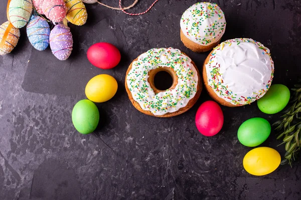 Easter, cake, eggs, holiday. Easter cake and colorful eggs on a dark background. It can be used as a background