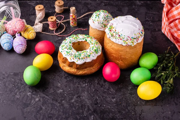 Easter, cake, eggs, holiday. Easter cake and colorful eggs on a dark background. It can be used as a background