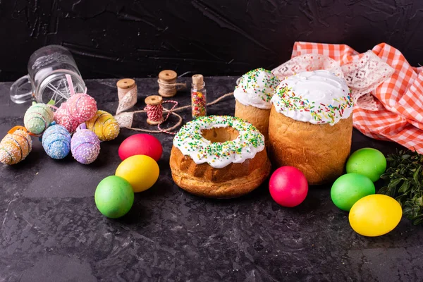 Easter, cake, eggs, holiday. Easter cake and colorful eggs on a dark background. It can be used as a background