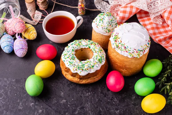 Easter, cake, eggs, holiday. Easter cake and colorful eggs on a dark background. It can be used as a background