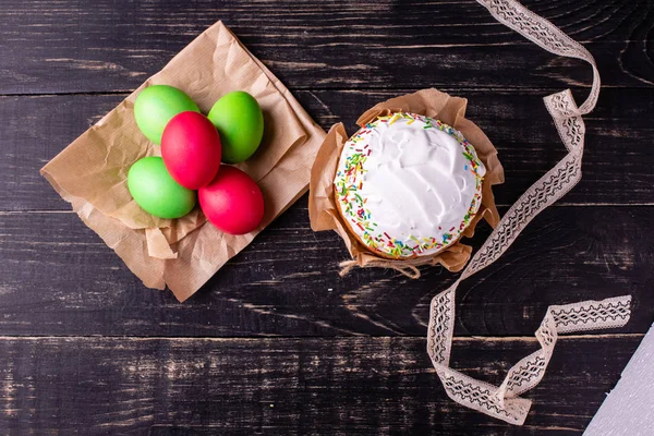 Easter, cake, eggs, holiday. Easter cake and colorful eggs on a dark background. It can be used as a background