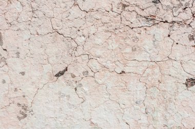 Doku, duvar, beton, arka plan olarak kullanılabilir. Çizik ve çatlaklarla dolu bir duvar parçası.