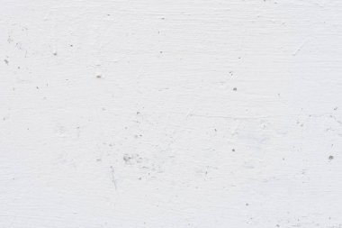 Çizik ve çatlaklarla dolu bir duvar parçası.