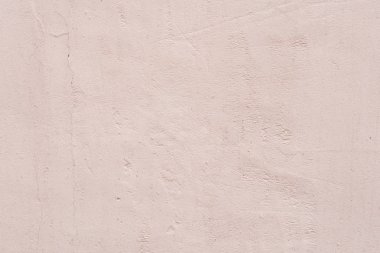 Çizik ve çatlaklarla dolu bir duvar parçası.