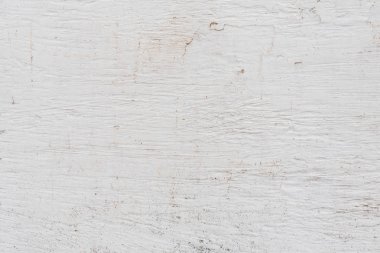 Çizik ve çatlaklarla dolu bir duvar parçası.