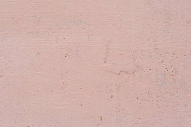 Çizik ve çatlaklarla dolu bir duvar parçası.