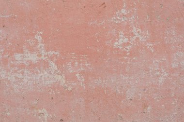 Çizik ve çatlaklarla dolu bir duvar parçası.