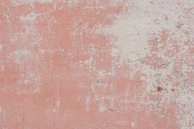 Çizik ve çatlaklarla dolu bir duvar parçası.