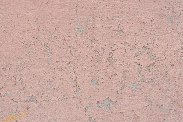 Çizik ve çatlaklarla dolu bir duvar parçası.
