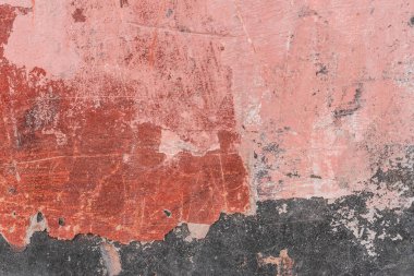 Çizik ve çatlaklarla dolu bir duvar parçası.